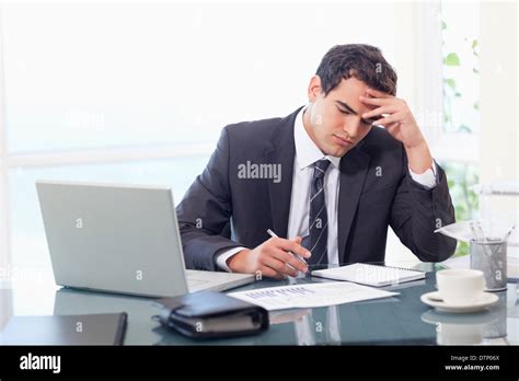 Focused businessman working Stock Photo - Alamy