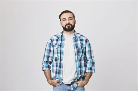 Free Photo | Confident bearded man in plaid shirt smiling