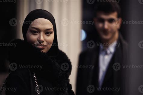 Happy multicultural business couple walking together outdoors in an ...