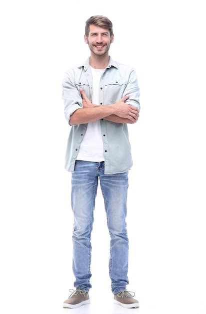 Premium Photo | In full growth smiling young man in jeans
