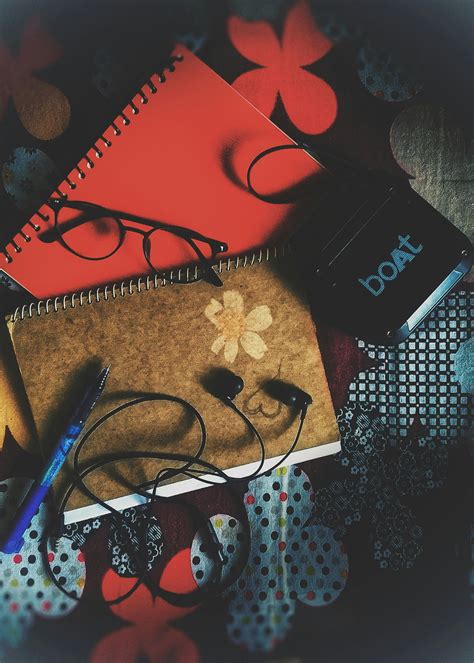 Black Earbuds on Notebook · Free Stock Photo