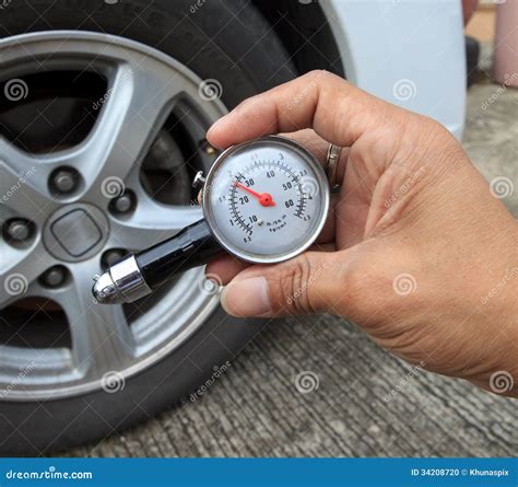 Checking Tire Air Pressure With Meter Gauge Before Traveling Stock ...