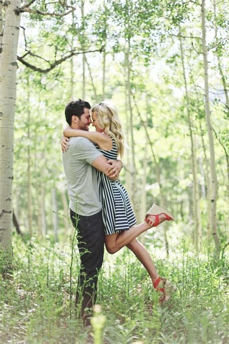 Download Couples Hugging With Grasses Picture | Wallpapers.com