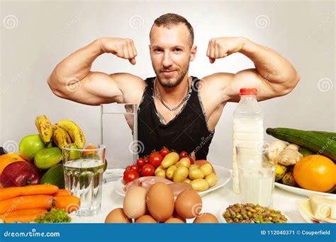 Fitness Young Man Presenting His Healthy Diet for Powerfull Body Stock ...