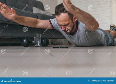 Fit Young Caucasian Man Doing Superman`s Exercise at Home, Training in ...