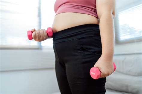 Premium Photo | Overweight woman exercising for weight loss exercise ...