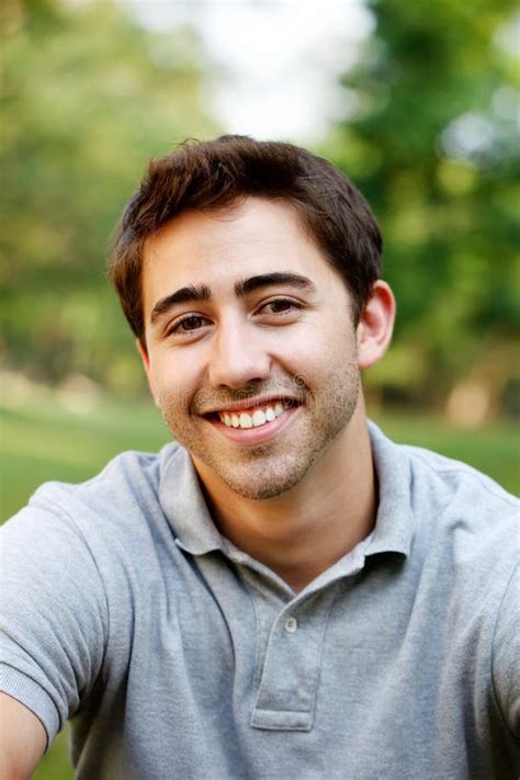Young Man in a Red Shirt, Hat Santa Claus and Tins Stock Photo - Image ...