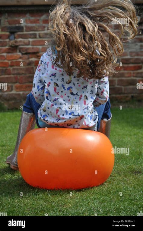 Inflated orange space hopper hi-res stock photography and images - Alamy