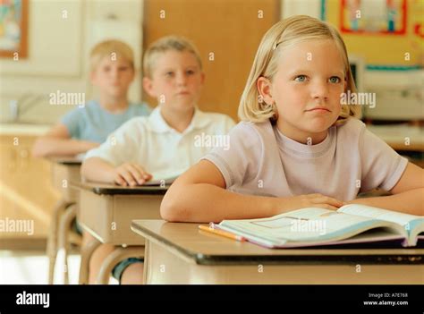 Attentive children in school classroom Stock Photo - Alamy