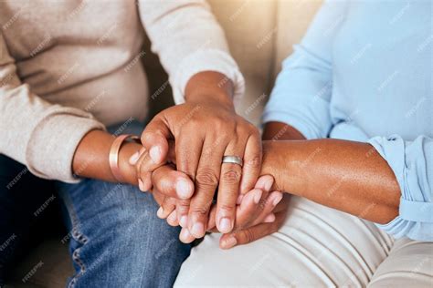 Premium Photo | Support love and closeup of people holding hands for comfort while sitting on a ...