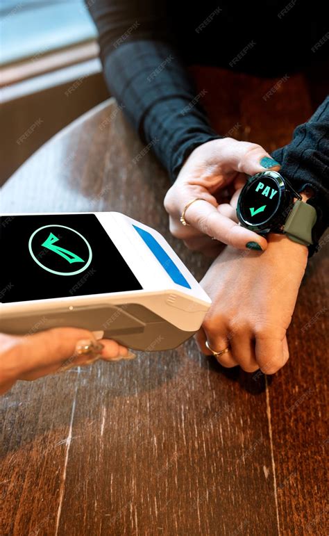 Premium Photo | Closeup view of a smartwatch payment at a pos terminal