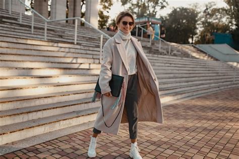 Free Photo | Stylish confident fashionable woman walking in street in elegant style coat