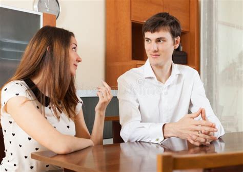 Serious Young Couple Talking Stock Image - Image of style, room: 55046225