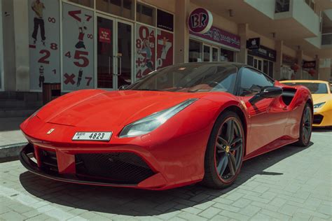Red Ferrari 458 Italia Parked Near Store · Free Stock Photo