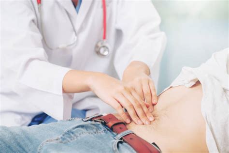 Doctor Patient Stomach Pain Stock Photos, Pictures &amp; Royalty-Free ...