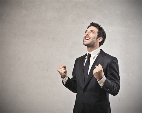 Premium Photo | Successful businessman cheering