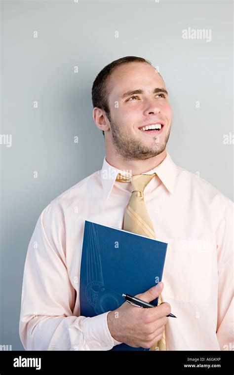 Office worker smiling Stock Photo - Alamy