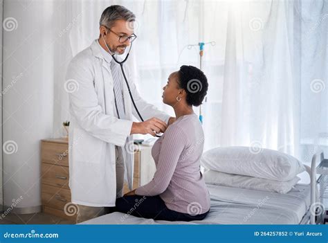 Cardiology Doctor Consulting Patient in Hospital for Heart Test, Healthcare and Wellness with ...