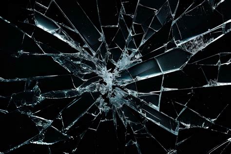 Cracked glass texture on black background. Smashed glass object with ...