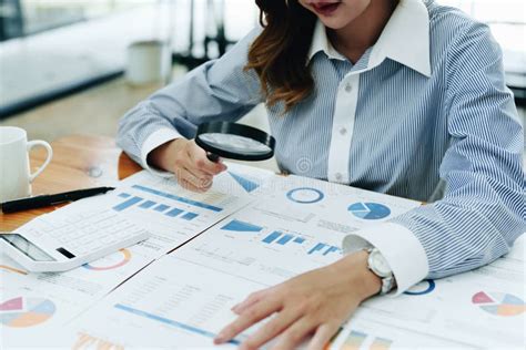 Financial Analysts Analyzing Business Financial Reports are Examining ...