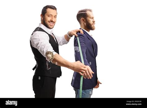 Profile shot of a tailor measuring a suit sleeve isolated on white ...