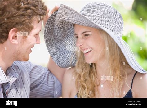 Couple laughing together outdoors Stock Photo - Alamy