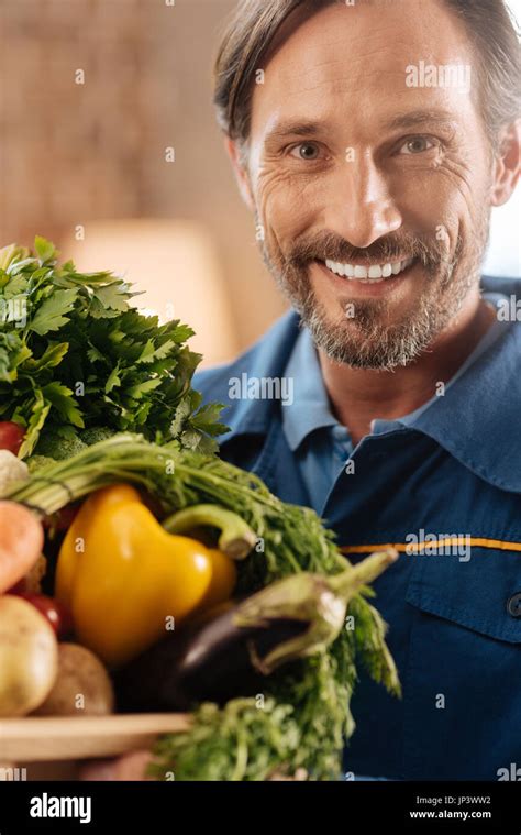 Charming energetic man loving what he doing Stock Photo - Alamy