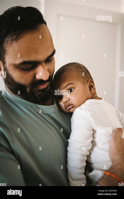 Father holding baby Stock Photo - Alamy