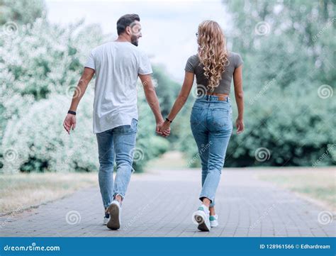 Couple in Love Walking in Park Holding Hands Stock Photo - Image of ...