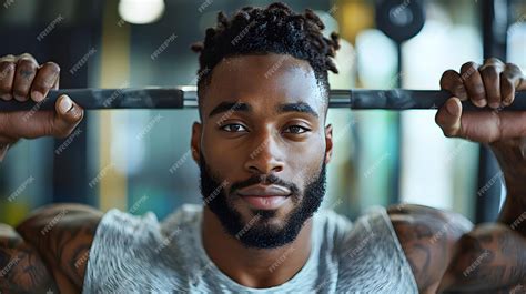Muscular African Man Lifting Weights in Gym During Intense Workout ...