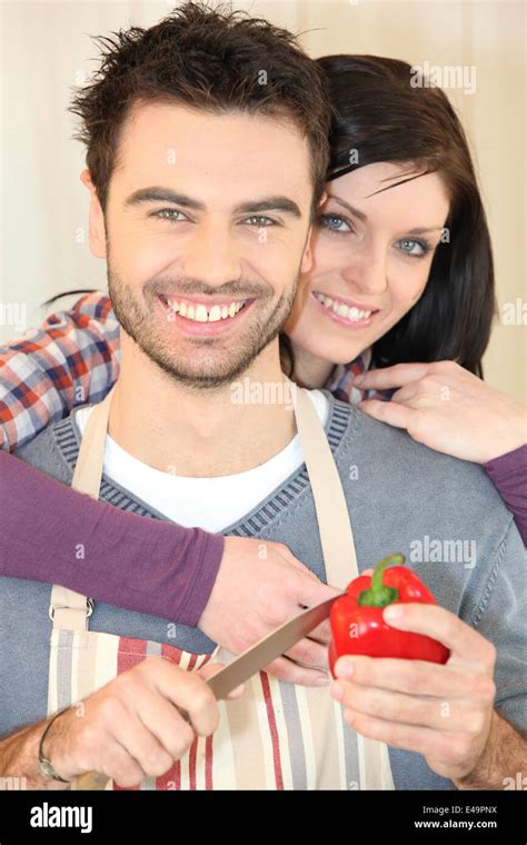 Couple cooking together Stock Photo - Alamy