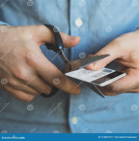 Man cutting credit card. stock image. Image of bankrupt - 113891577