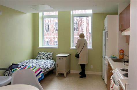 Cornerstone Housing for Women snips the ribbon for opening of 44 Eccles