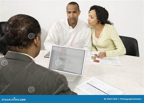 Couple Discussing Financial Plans with Male Advisor Stock Image - Image ...